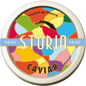 A colorful tin can label for Sturia Baerii Caviar, depicting various colors and the image of a sturgeon, indicating the product is vintage caviar.