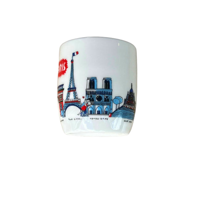 Ceramic mug with Paris-themed design featuring Eiffel Tower and Notre Dame on a white background