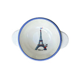 Ceramic bowl with Eiffel Tower design on a gray background