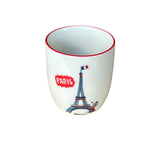 Ceramic cup with Eiffel Tower design and 'Paris' text on a gray background