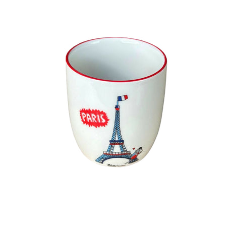 Ceramic cup with Eiffel Tower design and 'Paris' text on a gray background