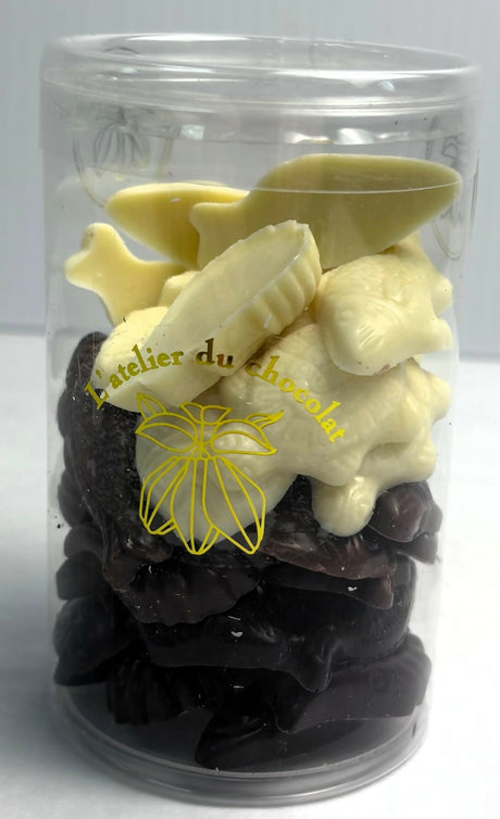 Jar of white and dark chocolate pieces with 'L'atelier du chocolat' branding.