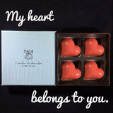 Delicate artisanal Chocolate hearts filled with passion fruit ganache