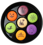 Halloween-themed macarons in a black dish
