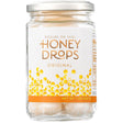 A 7 oz glass jar of Honey Drops Original honeycomb candies, featuring a white label with gold lettering and a honeycomb pattern, sealed with a silver metal lid on a white background.