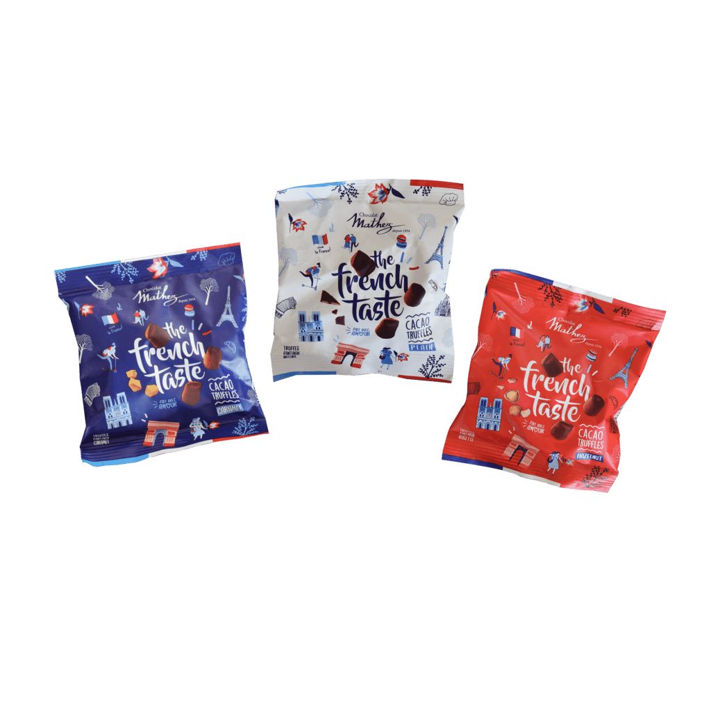 Three bags of 'The French Taste' snacks on a white background