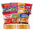 A collection of assorted French candy bags and individual wrapped caramels arranged on a plain white background. Visible brands include Haribo and Fini.