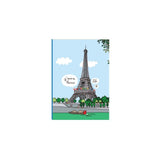A small notebook with a colorful illustration of the Eiffel Tower and a boat on the Seine River.