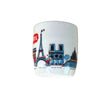 Ceramic mug with Paris-themed design featuring Eiffel Tower and Notre Dame on a white background