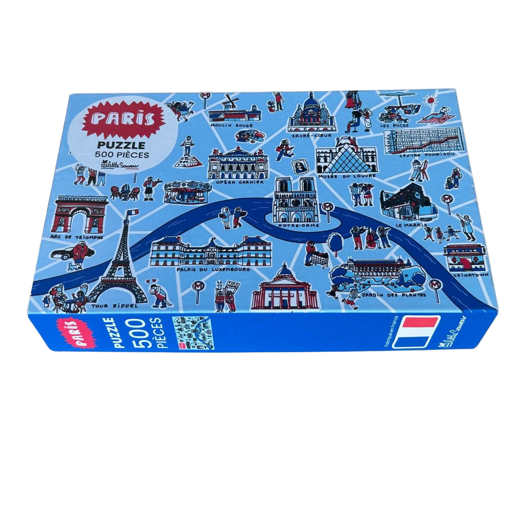 Piatnik puzzle box with Paris-themed illustrations on a gray background