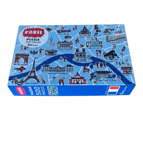 Piatnik puzzle box with Paris-themed illustrations on a gray background
