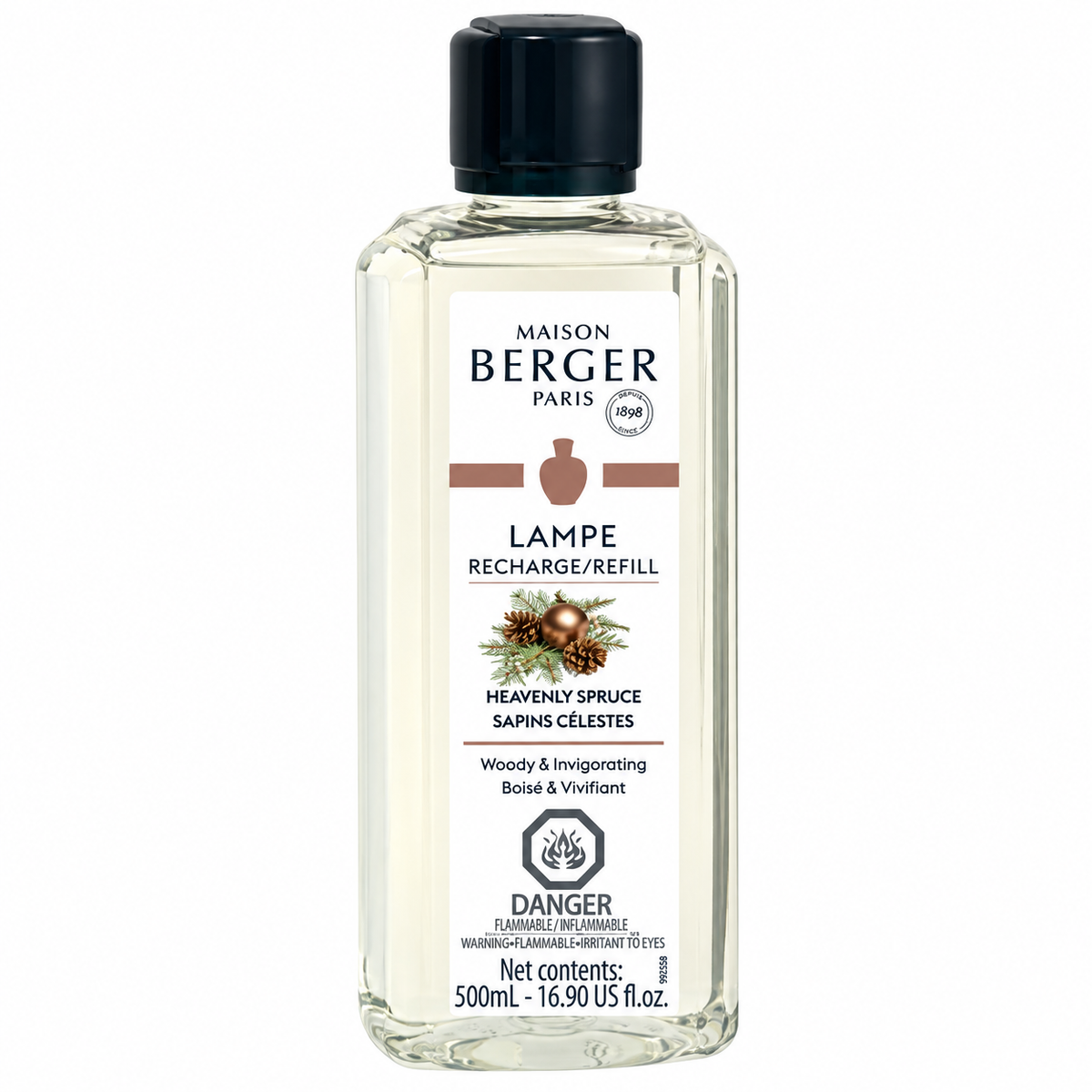 A 500ml bottle of Maison Berger Paris Lampe Recharge/Refill in the Heavenly Spruce scent, featuring a clear glass bottle with a black cap and a white label with brown and black text.