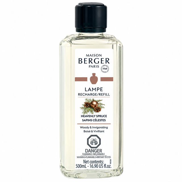 A 500ml bottle of Maison Berger Paris Lampe Recharge/Refill in the Heavenly Spruce scent, featuring a clear glass bottle with a black cap and a white label with brown and black text.
