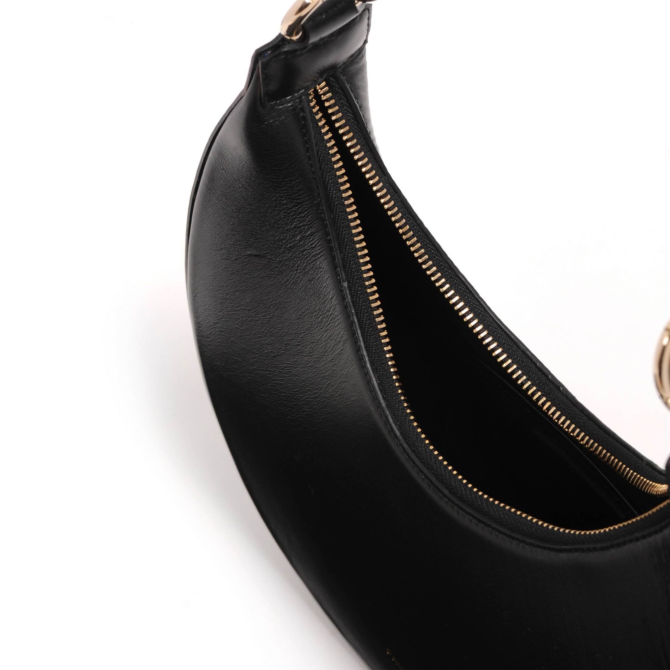 Half moon black leather handbag