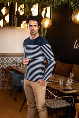 Man wearing the navy French Striped Mariniere in a restaurant