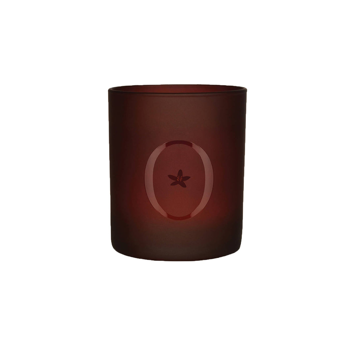 A brown scented candle with a star-shaped design on the upper part of the candle.